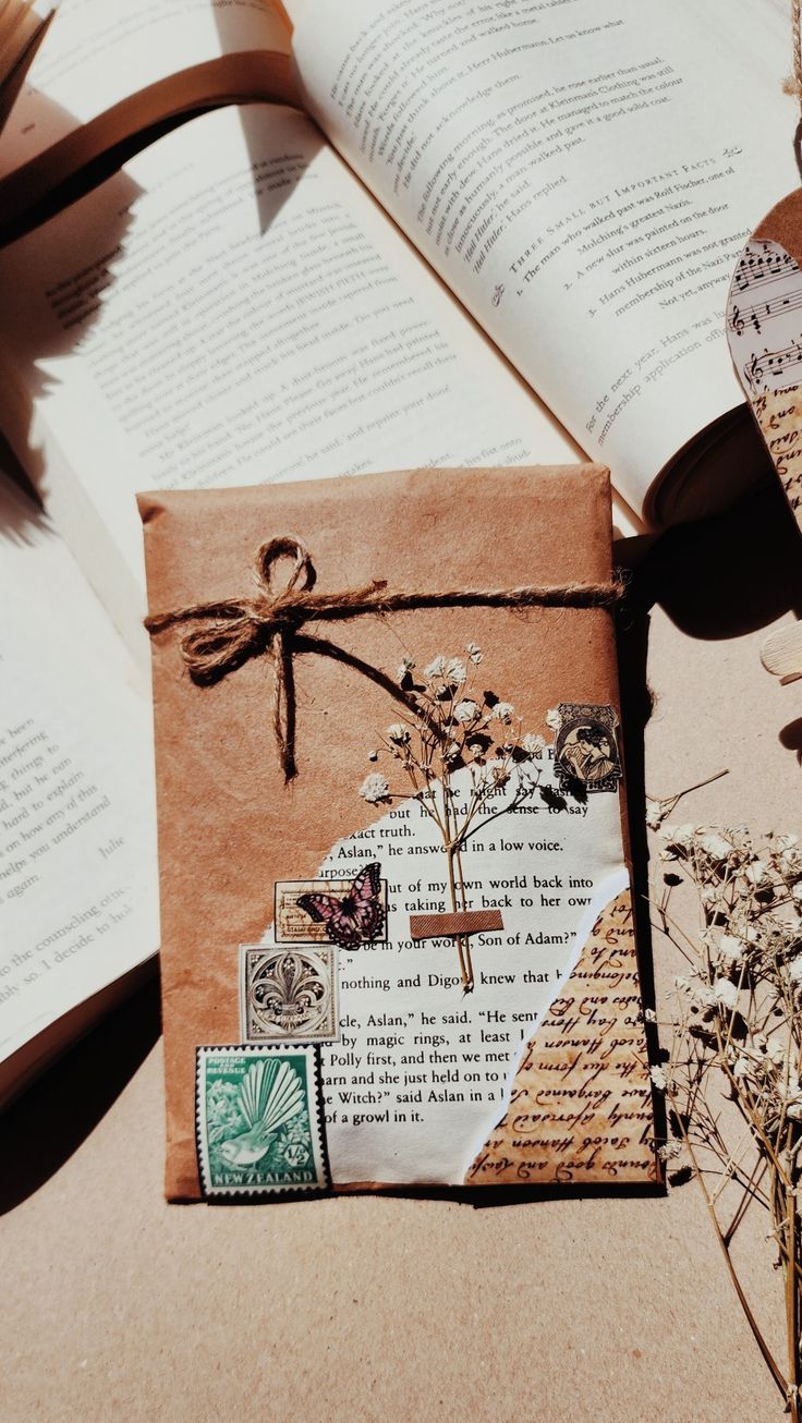 an open book and some papers on a table