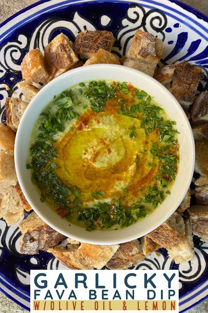 a bowl filled with food on top of a blue and white plate