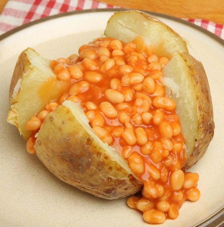 baked potato with beans on a white plate