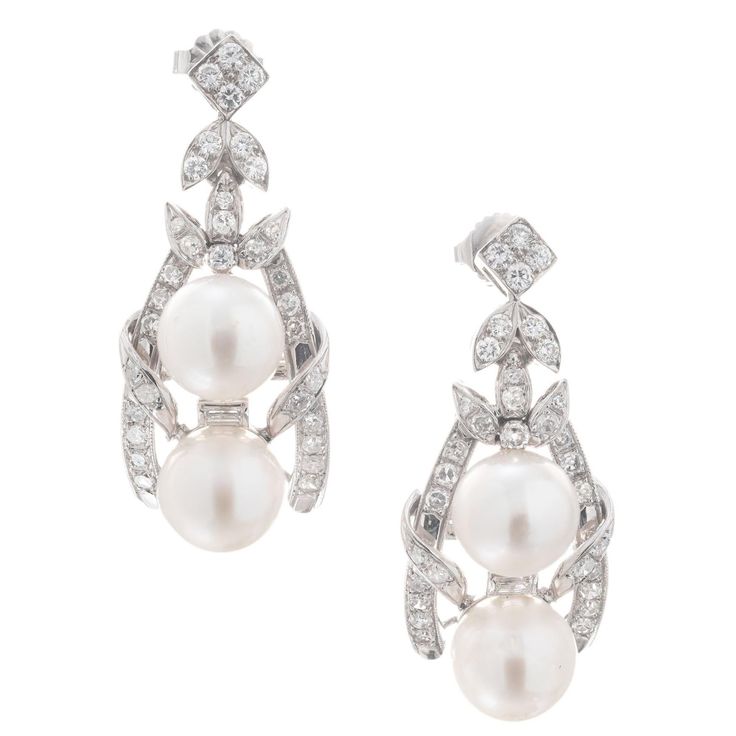 1960’s diamond a pearl dangle earrings. 4 round 8mm cultured pearls accented with 64 round brilliant cut and 2 baguette diamonds, in 14k white gold. 4 cultured white gray pearls, 9mm 64 round brilliant cut diamonds, F-G SI approx. 1.50cts 2 baguette cut diamonds, approx. .4cts 14k white gold Stamped: 585 15 grams Top to bottom: 36.0mm or 1 3/8 Inch Width: 15.3mm or 5/8 Inch Depth or thickness: 12.4mm White Pearl Earring, Pearl Dangle Earrings, Fancy Makeup, Cute Lazy Day Outfits, Baguette Diamonds, Baguette Cut Diamond, Pearl Earrings Dangle, Pearl Grey, Baguette Diamond