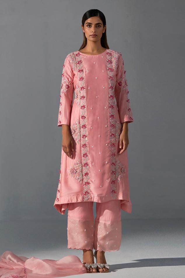 Pink kurta featuring zardozi embroidery embellished with floral applique and sequin work. Comes with matching pant and scalloped edge dupatta.
Components: 3
Pattern: Embroidered
Type Of Work: Zardozi
Neckline: Round
Sleeve Type: Full
Fabric: Bemberg Silk, Organza 
Color: Pink
Other Details: 
Length:
Kurta: 38-39 Inches 
Pant: 40 Inches
Occasion: Sangeet,Mehendi and Haldi - Aza Fashions Bollywood Style Floral Embroidery Palazzo Set For Reception, Designer Raw Silk Palazzo Set With Resham Embroidery, Spring Chanderi Salwar Kameez With Mirror Work, Festive Palazzo Set With Straight Kurta And Mirror Work, Unstitched Sets For Reception With Straight Kurta, Festive Palazzo Set With Mirror Work, Pant Set With Dabka Work For Wedding On Eid, Wedding Pant Set With Dabka Work On Straight Kurta, Wedding Pant Set With Dabka Work And Straight Kurta