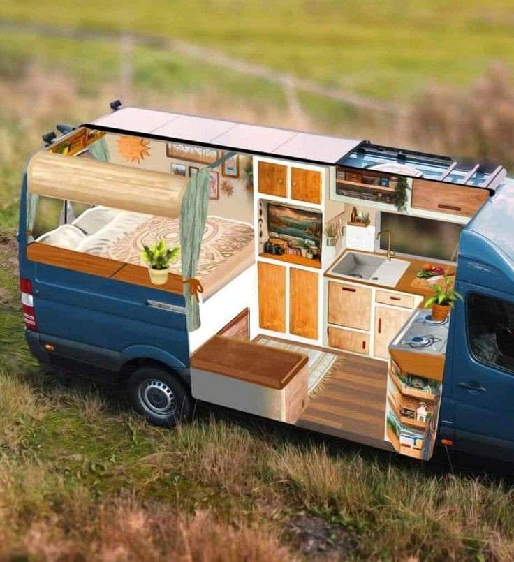 an rv is parked in the middle of a grassy field with its kitchen and dining area