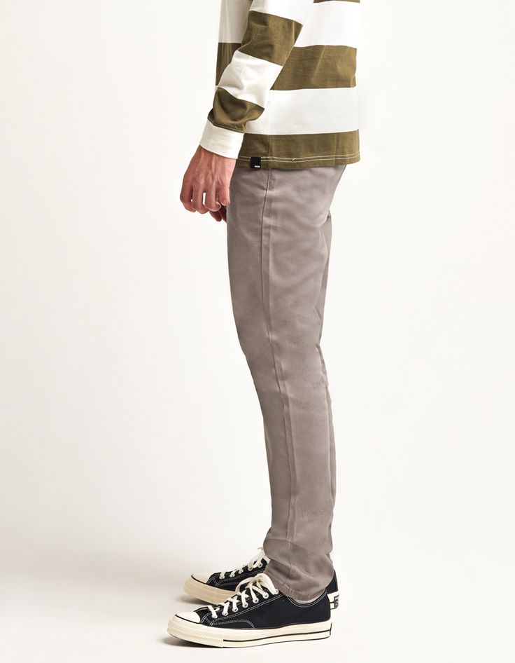 RSQ Skinny Chinos. Formerly known as the "Seattle Skinny Taper Chino Pants". Slant front pockets with welt back pockets and additional decorative pocket with RSQ tag at back left pocket. Approx leg opening: 13.5"(34cm). 97% cotton/3% spandex. Machine wash. Imported.Model is 6'2.5" wearing a size 31x32.Approx outseam: 41"Approx leg opening: 13.5" Casual Non-stretch Pants With Belt Loops, Casual Stretch Pants With Button Zip Fly, Casual Pants With Button Zip Fly, Casual Full-length Pants With Button Zip Fly, Cotton Pants With Button Zip Fly For Fall, Casual Fitted Pants With Buttons, Fitted Casual Pants With Buttons, Cotton Bottoms With Button Zip Fly For Fall, Fall Bottoms With Button Closure And Standard Cut Leg