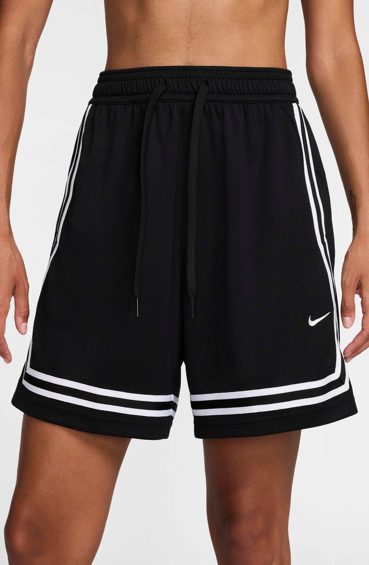 A wider fit through the legs and hips offers more room to move up and down the court in these sweat-wicking basketball shorts framed with contrast stripes. Elastic/drawstring waist Side-seam pockets Dri-FIT moisture-wicking technology 100% polyester Machine wash, dry flat Imported Shorts Nike, Basketball Shorts, The Court, Drawstring Waist, Crossover, Dri Fit, Basketball, Stripes, Nordstrom