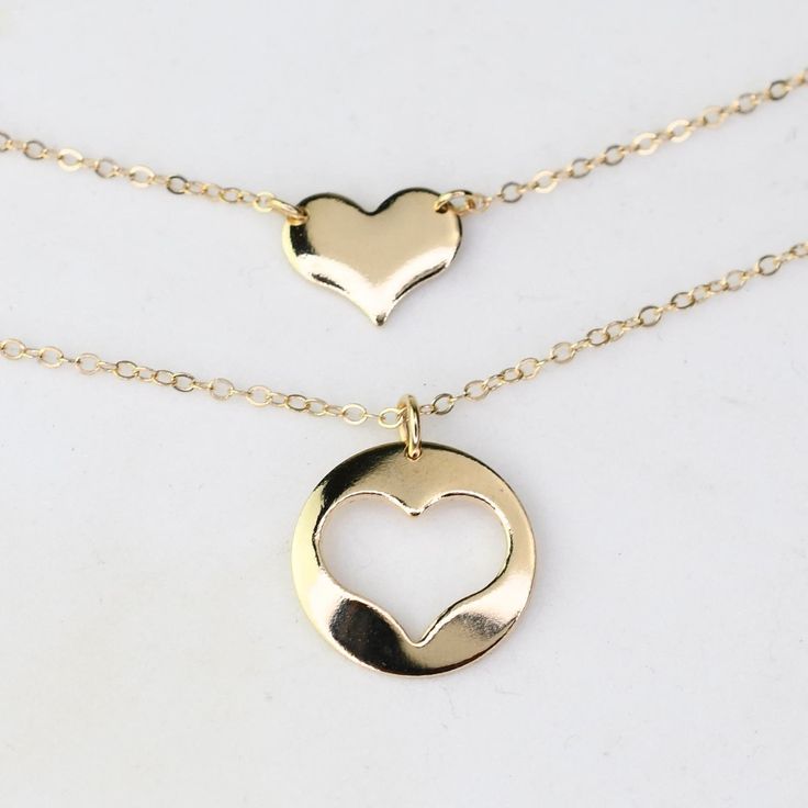 Mother Daughter Necklace Set. 14K gold necklace  Mother's necklace: - 14K gold charm is about 13mm, it is 22 gauge. - 14K gold necklace Daughter's Necklace: - 14K gold heart charm is about 10mm x 8mm, it is 22 gauge. - 14K gold necklace Necklace size chart: average 0 - 12 months 10" average 12 - 24 months 12" average 2-3 years 13" average 4-5 years 14" average 5-10 years 15"-16" 14K gold components Your necklaces will be shipped in a gift box. To see other Mother daughter set click here: https://www.etsy.com/shop/SashJewelry?section_id=12441134&ref=shopsection_leftnav_1 To see more children's jewelry click on the link below. http://www.etsy.com/shop/SashJewelry?section_id=12441132 To see more Sash Jewelry items click on the link below. http://www.etsy.com/shop/SashJewelry Please don't hesi Mother Daughter Jewelry Ideas, 14k Gold Filled Yellow Gold Charm Necklace For Anniversary, Everyday 14k Gold Double Heart Charm Necklace, 14k Gold Double Heart Charm Necklace, Everyday Double Heart 14k Gold Charm Necklace, Yellow Gold Open Heart Jewelry Gift For Mom, 14k Gold Filled Double Heart Jewelry Gift, 14k Gold Filled Open Heart Jewelry For Anniversary, 14k Gold Double Heart Charm Necklace Gift