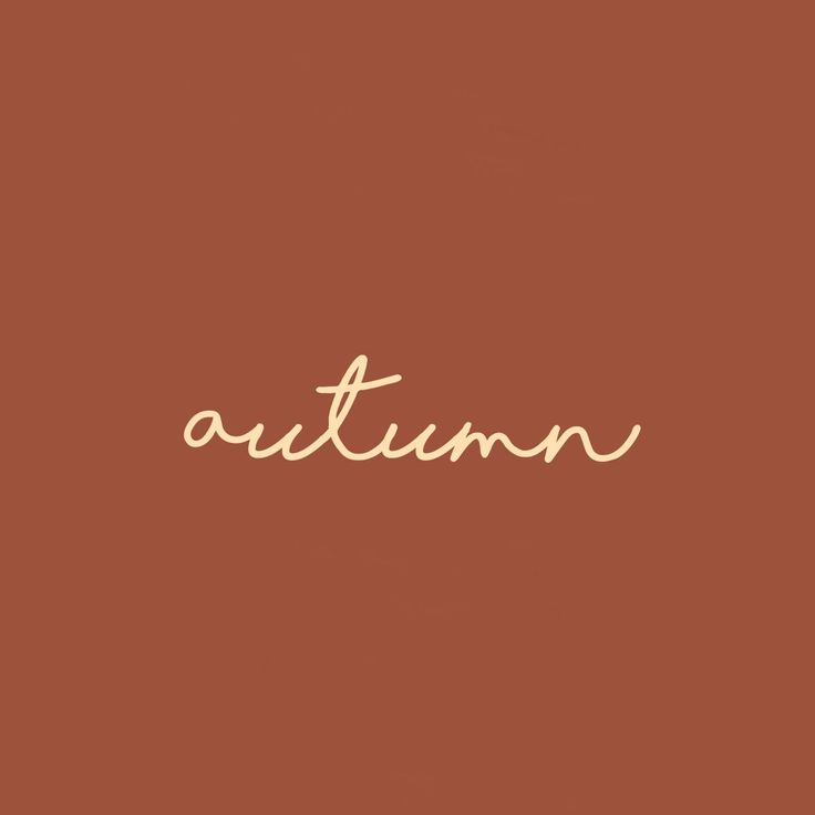 the word autumn written in cursive writing on a brown background