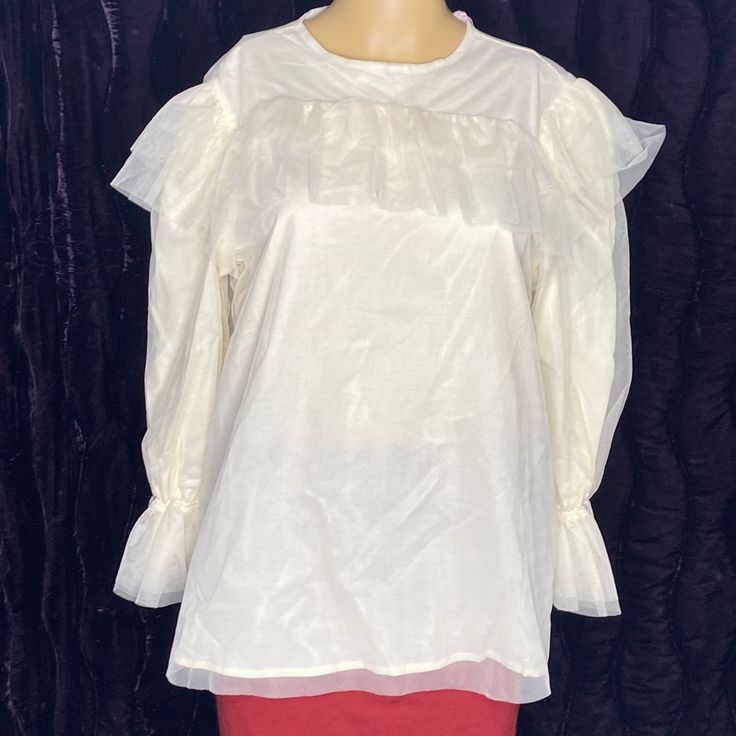 Ruffled Tulle Blouse Long Sleeve Ivory Color Size M #480 The Package Includes: 1 Blouse (Not The Skirt) Please Look At The Pictures The Pictures Are Not Professional Pictures Please See Listed Pictures For Full Details. Sold As Is. Comes As Is With What You See Pictures. What You See In The Picture Is What You Will Get. White Sheer Sleeves Top For Formal Occasions, White Formal Tops With Sheer Sleeves, White Formal Top With Sheer Sleeves, Formal White Tops With Sheer Sleeves, Elegant Tops With Sheer Sleeves For Brunch, Formal White Blouse With Sheer Sleeves, White Feminine Blouse With Sheer Sleeves, White Puff Sleeve Top With Sheer Sleeves, Cream Puff Sleeve Top For Party