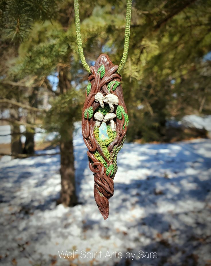 "In the forest there lies another world beyond the veil. A world, that when entered, is a world of beauty, fantasy, and ethereal beings. The Elven race, Fae, Fawns, Dryads...and many others! These Forest Keys are the keys for the doors to step through the veil! Each one has a crystal to aid you in your journey into this magical world!\" This Forest Key holds a small yet flashy Welo Opal nugget that is surrounded by Moss and tiny mushrooms! This piece was made to look like a twisted and viney \"k Hand Painted Green Spiritual Jewelry, Green Hand Painted Spiritual Jewelry, Spiritual Hand Painted Green Jewelry, Handmade Polymer Clay Jewelry In Fantasy Style, Unique Handmade Necklaces For Fantasy Events, Whimsical Clay Jewelry Gift, Handmade Nature-inspired Polymer Clay Jewelry, Whimsical Clay Jewelry For Gifts, Fantasy Polymer Clay Jewelry As A Gift