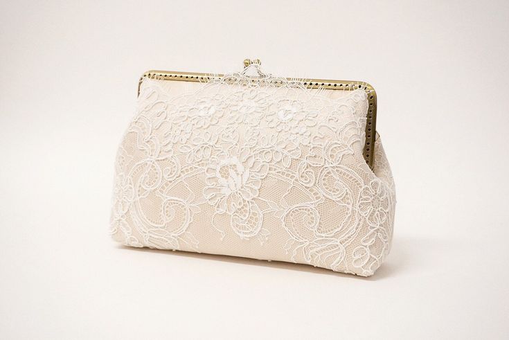 A must have accessory for elegant occasion ensembles This clutch purse is suitable for weddings, both formal and informal party and big enough to carry all your most needed essentials.  Dimensions: Frame width : 7" (measured across the opening)  Height : 5" (measured across the center)  Bottom width : 7.5" Depth : 2" Removeable Chains : 17" Don't see what you need listed in my shop? Feel free to contact me for a special request. I love working on custom designs to match any occasion's theme! . Elegant Cream Rectangular Evening Bag, Elegant Cream Clutch For Party, Feminine Beige Evening Bag For Formal Occasions, Elegant Clutch For Wedding, Elegant Cream Rectangular Clutch, Elegant Cream Bridal Accessories, Classic White Wedding Bag, Elegant Beige Clutch For Wedding Guest, Elegant Cream Clutch For Events