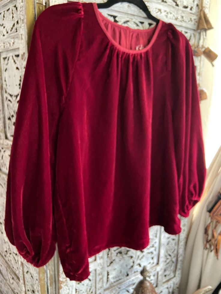 "Velvet shirt blouse tunic I have  two available colors: deep red  black **I have a few of each color. some have tags, some don't but all are new. New Size S Beautiful top & the material is so soft measure flat approx: 22\"chest  25\" Length poly velvet  made in india NO REFUNDS OR EXCHANGES please contact us if there are any concerns with your purchase..if for any reason a refund is agreed upon, return shipping cost is buyers responsibility..no exceptions." Red Lantern Sleeve Top For Fall, Red Lantern Sleeve Blouse For Fall, Red Balloon Sleeve Tops For Fall, Fall Party Top With Gathered Sleeves, Winter Velvet Long Sleeve Tops, Red Velvet Party Tops, Red Long Sleeve Blouse With Blouson Sleeves, Fall Velvet Long Sleeve Tops, Velvet Long Sleeve Tops For Fall