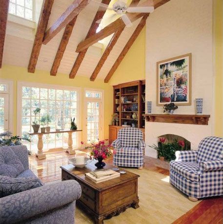 a living room filled with furniture and a fire place