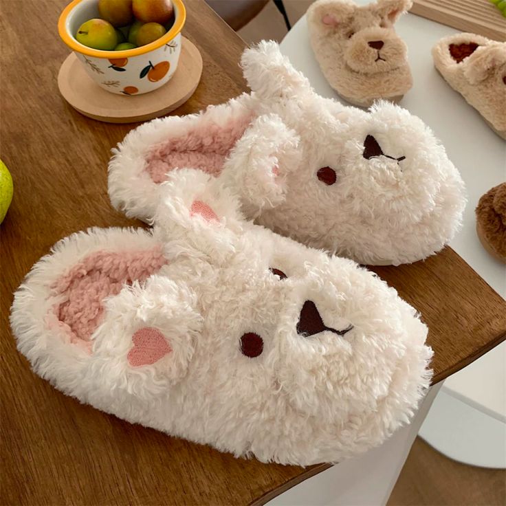 Walk on a cloud with our Jeannie Slippers! With their adorable bunny design and fluff, these slippers are perfect for sleepovers and for your home. Their unique design will get you compliments from your friends and family. There are so many colors to chose from, you can find the perfect pair for you! Jeannie Slippers will make for a perfect gift as well. Features: Style Closed-toe Suitable occasion Home slippers Sole material Rubber TPR Vamp material Soft and comfy fluffy fabric Season Winter/Fa Cute Fluffy Slippers With Round Toe, Comfortable Plush Slippers With Round Toe, Cute Soft Indoor Slippers, Cute Soft Slippers For Indoor Use, Fluffy Flat Indoor Slippers, Comfortable Fluffy White Slippers, Casual Plush Slippers For Winter, Plush Slippers With Round Toe And Plush Lining, Cute Super Soft Indoor Slippers