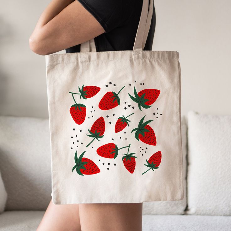 This Red Strawberry Tote Bag is a stylish upgrade to reusable tote bags. This Cute Strawberry Aesthetic Bag make a great reusable tote for yourself or as a gift tote.  ⚡ USA fast delivery. We deliver within a week. ⚡ Our Tote Bags are made with 100% cotton sheeting. Add their reinforced handle stitching to the mix, and you got a reliable bag rich in both practicality and durability. These durable totes are crafted with a last technological DTG printer for a vibrant flawless finish. Tote bags wil Red Eco-friendly Canvas Shopping Bag, Red Reusable Shopping Bag, Red Reusable Casual Bag, Red Bag With Strawberry Print As Gift, Eco-friendly Red Canvas Bag As Gift, Red Casual Reusable Bag, Eco-friendly Red Reusable Bag, Red Reusable Everyday Bag, Rectangular Bags With Strawberry Print As Gift