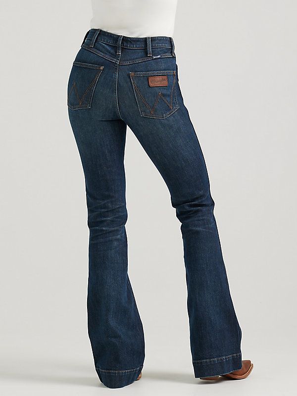 HAVE YOU MET BAILEY? Flattering from every angle, the Women’s Wrangler Retro® Bailey High Rise Trouser Jean is a best-kept secret for ladies who love volume. These denim trousers are crafted from a cotton blend with just a hint of stretch for all-day comfort. They come with a high-rise silhouette, a close fit through the thigh, and a 20.5” flared leg full of vintage vibes. Plus, the five-pocket styling, “W” pocket stitching, and logo patch bring an unmatched level of Western authenticity. Women’s Wrangler Jeans, Women Wrangler Jeans, Wrangler Jeans Women's Outfit, Wrangler Jeans Women's, Western Jeans, Southern Outfits, Country Style Outfits, Long Sleeve Kids, Boys Bottoms