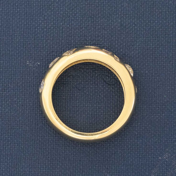 We've come across plenty of vintage rings n this style - we refer to them as scatter bands, as they are usually a chunky gold canvas with old cut diamonds scattered throughout. We had our jewelers set these recycled antique old mine, old European cut and step cut diamonds in a random orientation, giving you a ring that is both modern and rustic at the same time. She's so chic and sparkly, we are in love with how she came out! 18kt Yellow Gold Size 6 & resizable 5.90mm Wide Timeless Gold Sapphire Ring With Single Cut Diamonds, Antique Yellow Gold Diamond Ring With Bezel Setting, Gold Dome Ring With Bezel Setting Diamond, Vintage Gold Sapphire Ring With Bezel Setting, Heirloom Dome Ring With Single Cut Diamonds, Vintage Baguette Cut Diamond Accented Jewelry, Vintage Yellow Gold Rings With Bezel Setting, Antique Gold Sapphire Ring With Diamonds, Vintage Gold Diamond Ring With Bezel Setting