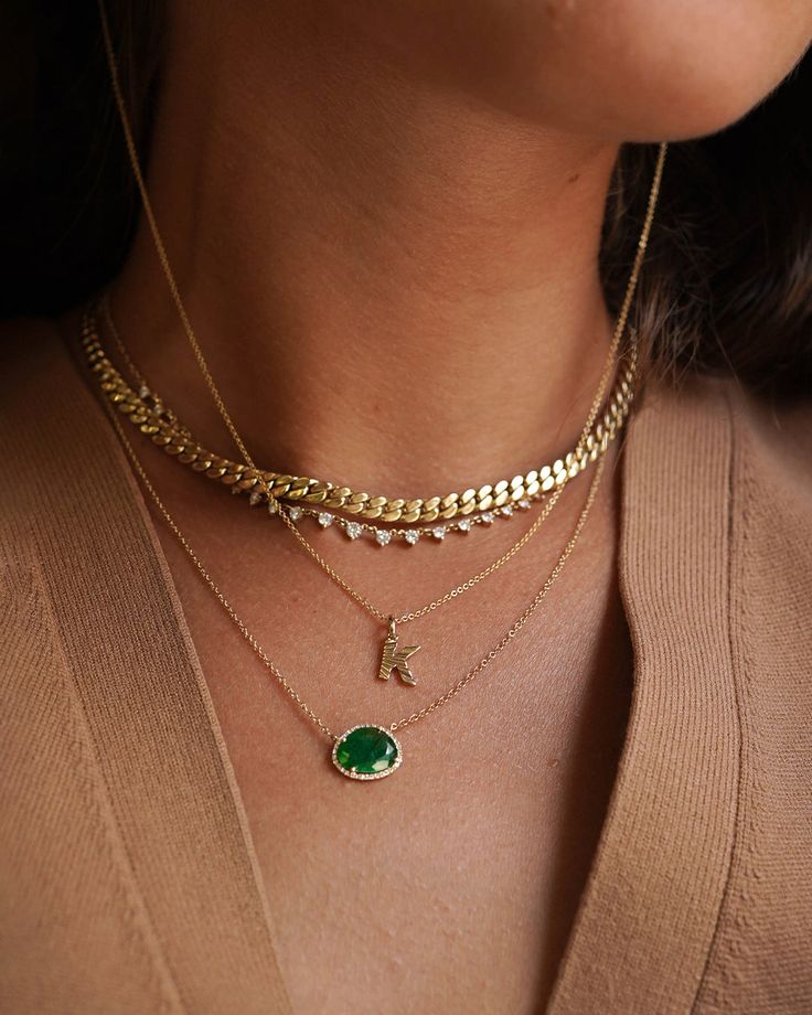 14k solid gold, pave diamond, and a beautifully handpicked free form emerald, available in yellow, white and rose gold, hanging from a 16''-18'' adjustable chain. Timeless and perfectly handcrafted, wear it up or down, by itself or layered. Size of Emerald: Approx. 13mm(W) by 11mm(H) Diamond Carat Weight: Approx. 0.08 ctw Diamond Quality: VS Total Weight: Approx. 2 grams Due to the nature of this item all stones may vary in color and inclusions making each piece a one of a kind Standard Producti Gold Emerald Necklace With Adjustable Chain, Gold Emerald Necklace With Diamond Accents, 14k Gold Green Necklace With Diamond Accents, Green 14k Gold Necklace With Diamond Accents, Green 14k Gold Necklace With Adjustable Chain, Gold Emerald Necklace With Diamond Accents For May Birthstone, Emerald Mangalsutra, Emerald Necklace Gold, Diamond Emerald Necklace