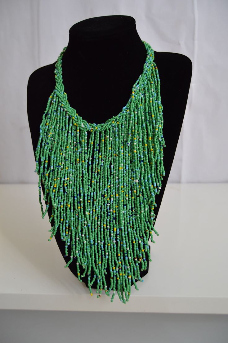 This Beaded African necklace is made with the finest quality beads that bring out mother earths most beautiful colors. It is traditionally worn by Kenyan women on special occasions such as weddings. Normal Fit. One size fits all. Perfect gift for that Special Person in your life. Thanks for Passing By :) Kenyan Women, Most Beautiful Colors, African Necklace, Maasai, Green Bead, Special Person, Kenya, One Size Fits All, Turquoise Necklace