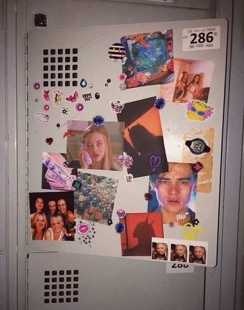 a refrigerator covered in magnets and pictures