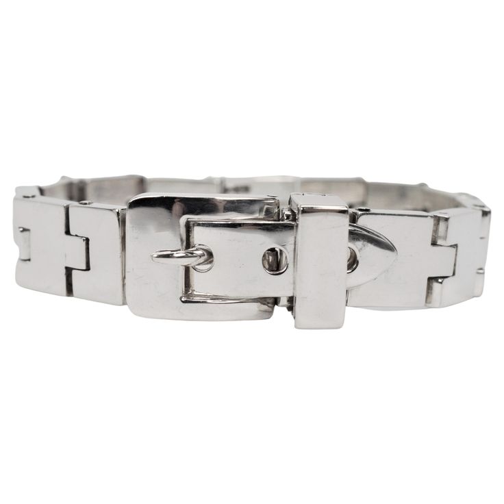 Substantial in heft, multiple hinged sterling silver links, 3.5mm thick, create this interesting 7-1/2 inch bold bracelet and lead to the large polished silver buckle clasp feature. Crafted in sterling, the "belt strap" fits nicely into the belt frame with a silver prong creating a sharp stylish look. A silver safety clamp folds over to secure and finish the piece. Gift boxed. Formal Modern Sterling Silver Bracelet, Classic Sterling Silver Bracelet For Formal Occasions, Polished Sterling Silver Bracelet For Formal Occasions, Modern Silver Bracelet With Box Clasp, Formal Sterling Silver Bracelets With Box Clasp, Modern White Gold Bracelets With Box Clasp, Classic Rectangular Bracelet With Box Clasp, Classic Bracelet With Box Clasp, Modern Sterling Silver Bracelet With Box Clasp