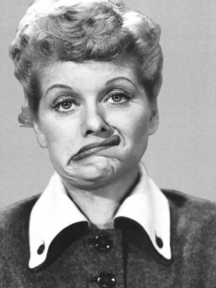 a black and white photo of a woman making a funny face