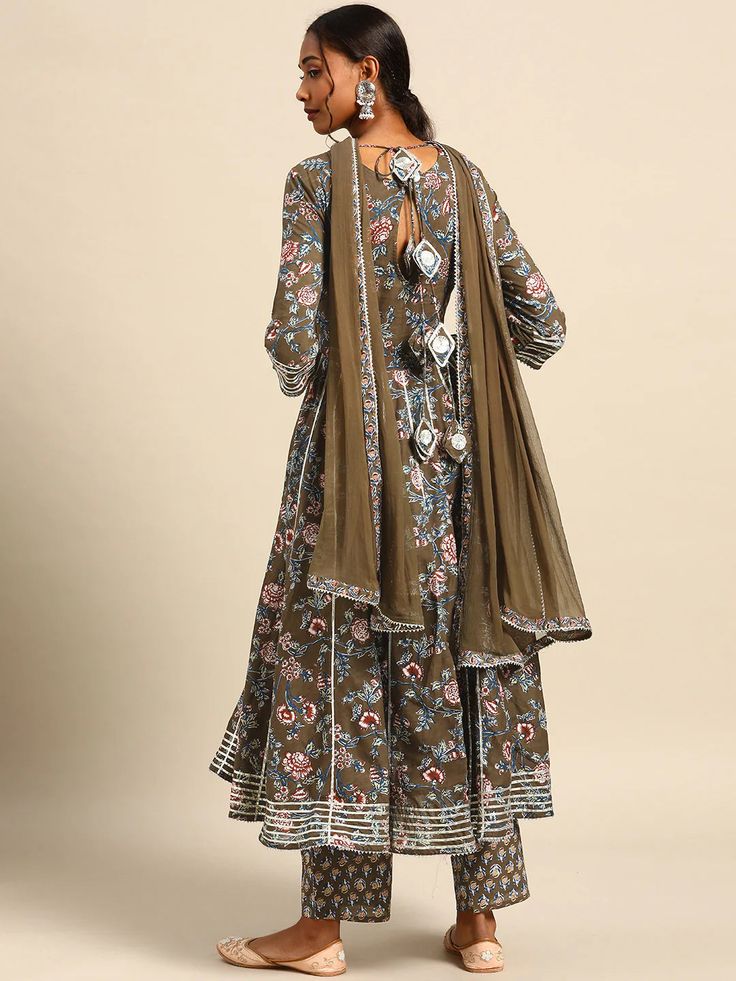 This is a beautiful 3-piece set. The set comes with floral print & gota patti detailing angrakha kurta has round neck, calf length and 3/4th sleeves teamed with printed trouser pants and a chiffon dupatta. Total No of Set-3 Kurta Fabric: Cotton Bottom Fabric - Cotton Dupatta Fabric-Chiffon Work Done - Gota Patti & Print Detailing. Sleeve Length: 3/4th Sleeves Color: Green Occasion: Party Wear Washing Instructions: Hand Wash or Dry Clean