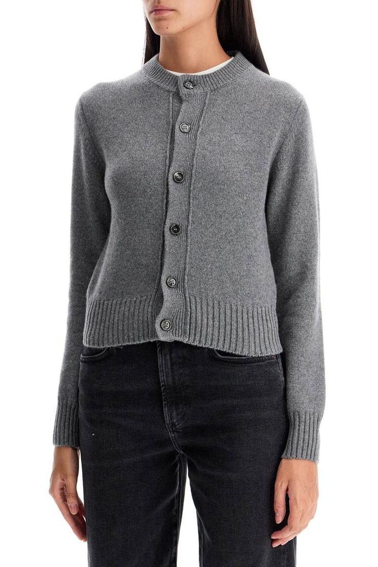 This Ami Paris crew neck cardigan is made of soft cashmere with ribbed edges. It has a short cut with a classic button closure and the 'Ami de Coeur' logo embroidered in tone on the chest. Regular fit. The model is 177 cm tall and wears size XS.Gender: WomenMaterial: 97%CASHMERE 3%WOOLColor: GREYMade in: IMPORTEDProduct ID: FKC157 005 052*Import tax/duty will be calculated at checkout (If applicable) Crew Neck Cardigan, Messenger Bag Backpack, Contour Kit, Dress Attire, Louis Vuitton Designer, Ami Paris, Pleats Please Issey Miyake, Short Cut, Boot Pumps