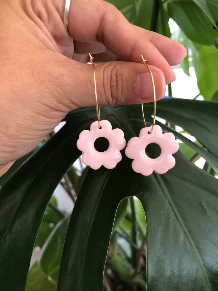 Lightweight earrings, that come in a beautiful light pink shade.   Made with polymer clay topped off with resin on a gold hoop.   Each pair of earrings are hand made so there might be some special distinctions on them. They all come with their own personalities or character if you will. They are all unique in their own way, therefore there are no 2 that are exactly the same.  Care instructions -  Store in a clean dry area.  Do not wear in water.  You may clean your earrings with a soft damp towe Pink Clay Earrings, Pink Shade, Pink Clay, Earrings Polymer Clay, Lightweight Earrings, Earrings Statement, Pink Earrings, Etsy Earrings Dangle, Light Weight Earrings