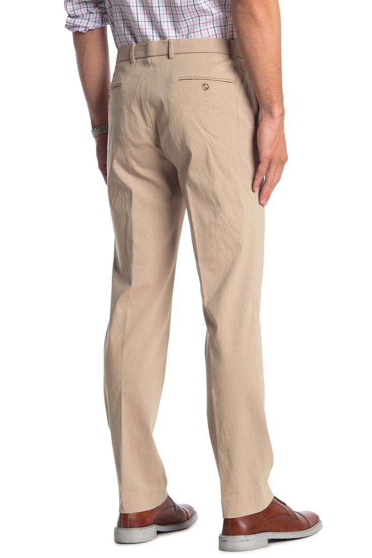 Fit: this style fits true to size. Zip fly with hook-and-bar and button closure. Front slash pockets; back besom pockets. Solid tan. Light stretch. Approx. 10.5" rise (size 34x32). Imported Fitted Chino Cotton Twill Bottoms For Business Casual, 4-way Stretch Dress Pants For Business Casual In Spring, Spring 4-way Stretch Dress Pants For Business Casual, Tailored Spring Pants With 5-inch Inseam, 4-way Stretch Cotton Pants For Business Casual, Solid Flat Front Chinos For Business Casual, Slim Fit Wide Leg Chinos For Business Casual, Solid Color Flat Front Chinos For Business Casual, Business Casual Slim Fit Wide Leg Chinos