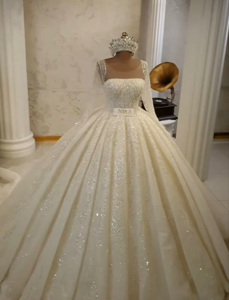 a wedding dress on display in a room