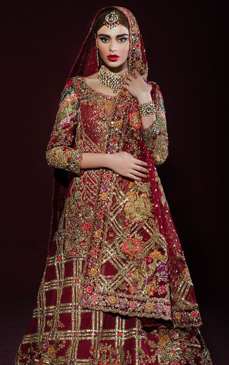 This bridal lehenga is featured in a red color shirt with zardozi hand embroidery all over it. Lehenga skirt is in red colour with heavily embroidered in gotta and zardozi work. Dupatta is also in red colour with heavy embroidered edges. This lehenga set can wear in 3 styles 1. In full set same as displayed on the model 2. Top with pant ( pant comes complimentary) 3. Lehenga Skirt with Blouse of your Choice This bridal lehenga set can be customised in any color of your choice. Work Design Blouse, Pakistani Bridal Dresses Online, Shalwar Suit, Latest Bridal Lehenga Designs, Mehndi Outfits, Red Bridal Dress, Latest Bridal Lehenga, Asian Wedding Dress, Latest Bridal Dresses