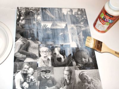 a collage of photos and a paintbrush next to it on a white table