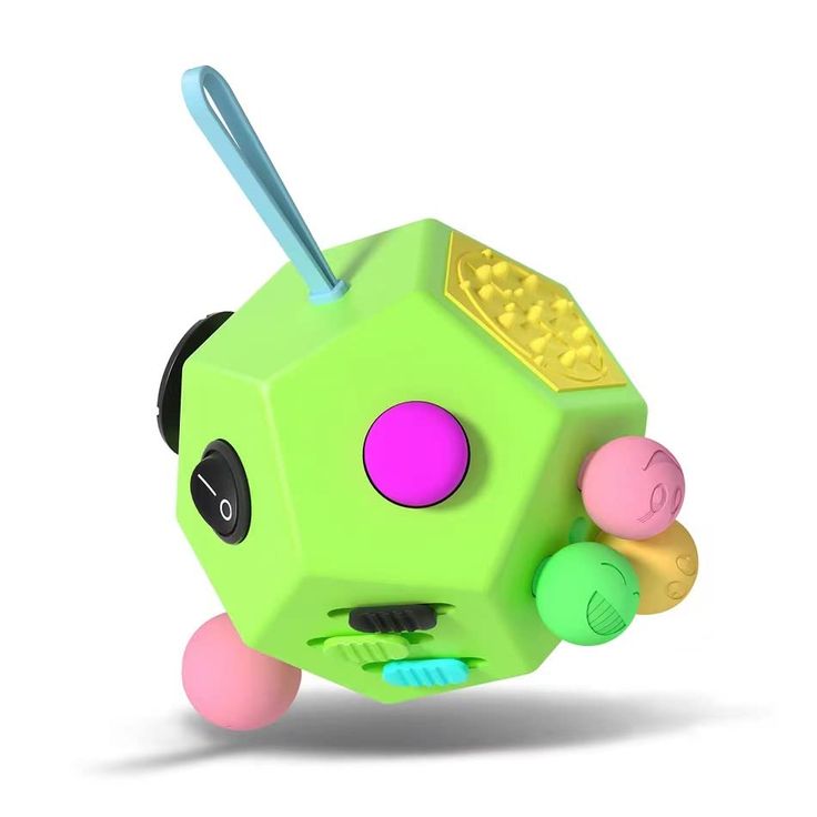 a green toy with pink, yellow and blue balls in it's mouth on a white background