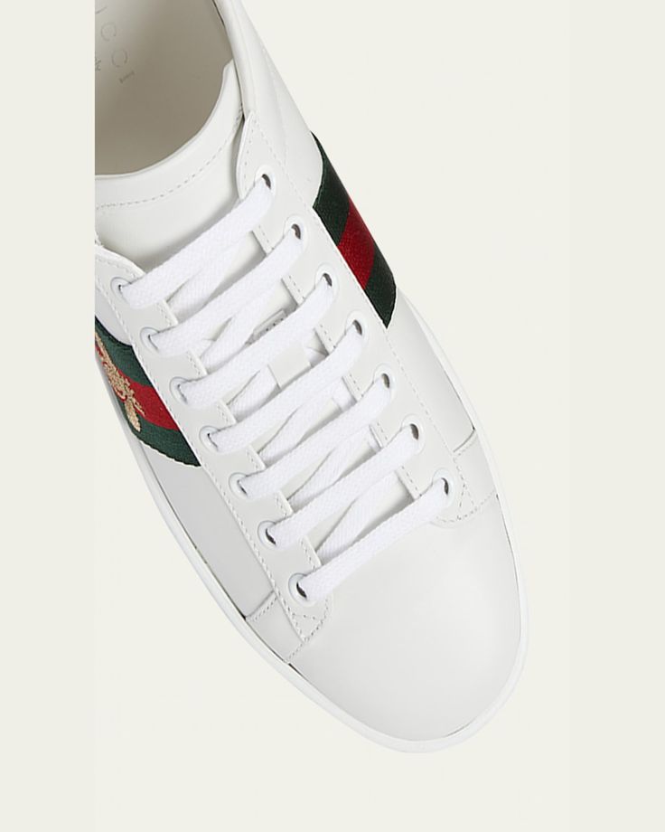 Gucci leather sneaker with bee embroidery at green/red/green webbing.    0.3" flat heel with platform.    Round toe.    Laceup vamp.    Metallic logo backstay.    Padded footbed.    Rubber outsole.    Made in Italy. Gucci Designer Platform Sneakers With Round Toe, Designer Gucci Platform Sneakers With Round Toe, Gucci Leather Low-top Platform Sneakers, Gucci Low-top Platform Sneakers With Branded Insole, Gucci Leather Platform Sneakers, Casual Gucci Platform Sneakers With Round Toe, Gucci Custom Lace-up Sneakers With Embroidered Logo, Gucci Custom Low-top Sneakers With Embroidered Logo, Custom Gucci Low-top Sneakers With Embroidered Logo