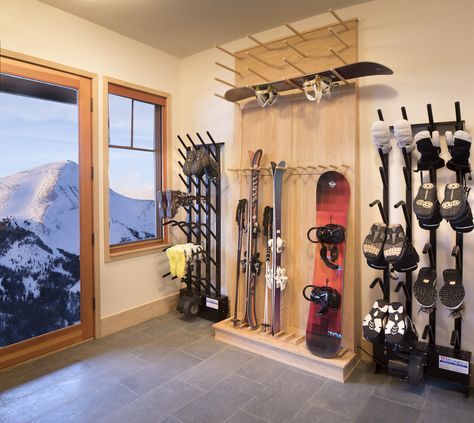 a snowboard and ski equipment rack in a room