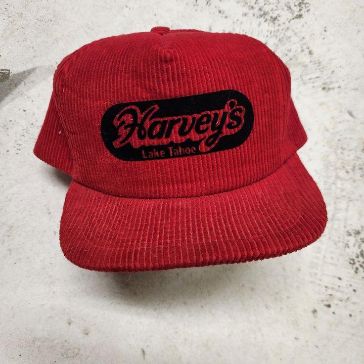 Excellent preloved red courdoroy hat from Harvey's casino, lake tahoe. Good form to the hat, 70s 80s vintage hat. Adjustable snap back. One size. Retro Red Hat With Curved Brim, Red Retro Hat With Curved Brim, Vintage Red Snapback Hat With Flat Bill, Retro Red Cap, Retro Red Hat With Flat Bill, Retro Red Hats With Flat Bill, Retro Red Flat Bill Hat, Vintage Red Flat Cap, Retro Red Flat Cap