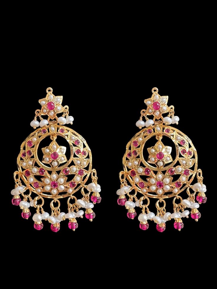 earrings gold plated on 92.5 silver gwt-20.08 grams nw- 13.70 GMs Freshbwater pearls used with high quality rubies Length 2.2 inch width 1.2 inch Heavy 22k Gold Chandbali Earrings, Heavy 22k Gold Chandbalis For Diwali, Heavy Chandbali Danglers In Yellow Gold, Gold Dual-tone Chandbali Earrings, Heavy 22k Gold Chandbalis For Festivals, 22k Gold Chandbali Earrings With Cutdana, 22k Gold Cutdana Chandbali Danglers, Ruby Chandbali Bridal Earrings For Festivals, Festival Ruby Chandbali Bridal Earrings