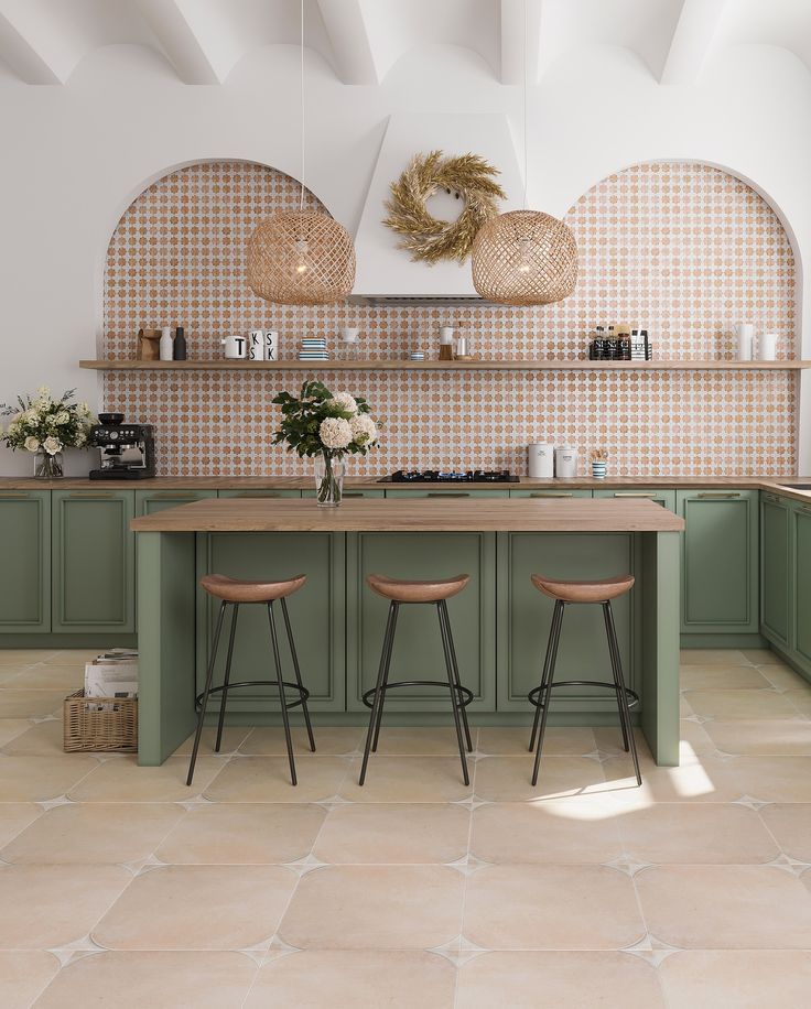 a kitchen with green cabinets and stools next to a counter top in the center