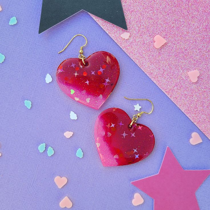 Product Specifications: 💖 Material: Craft resin 💖 Earring Size: Approx. 6 cm hanging 💖 Closure: Gold coloured hooks 💖 Colour: Red, pink 💖 Handmade 💖 Doming: Yes Heart-shaped Earrings With Heart Detail As Gift, Trendy Resin Jewelry For Valentine's Day, Pink Heart Charm Earrings, Resin Heart Earrings For Gifts, Pink Resin Heart Earrings For Gift, Pink Resin Heart Earrings As Gift, Pink Heart Resin Earrings, Cute Resin Heart Earrings For Valentine's Day, Heart Shaped Resin Jewelry For Party