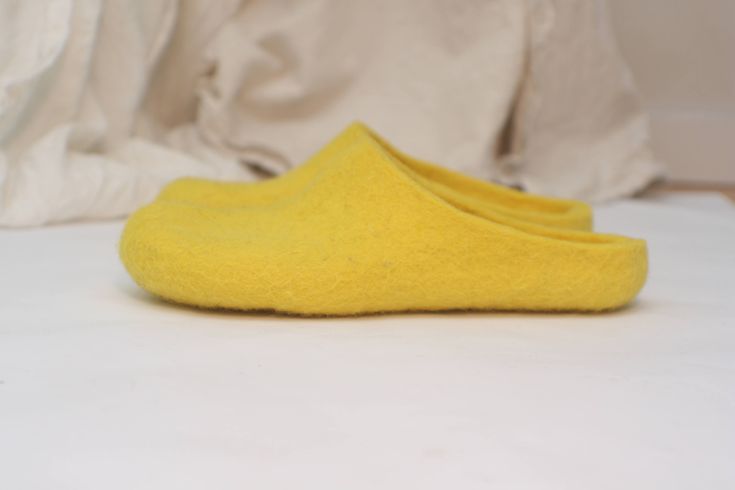 Felted slippers for women of bright yellow wool - an excellent gift for Christmas, birthday or housewarming. Felt is a perfect material for footwear. It is extremely wear-proof and warm. When you put them on, you won't want to take the slippers off. They will definitely make a part of your home outfit. Non-slip sole is covered with natural latex. Now slippers are also available in rubber soles. Please follow the link if interested https://www.etsy.com/listing/100254500/rubber-soles-for-felted-sl Yellow Slip-on Winter Slippers, Comfortable Yellow Slip-on Slippers, Casual Yellow Slippers With Rubber Sole, Yellow Casual Flat Slippers, Casual Yellow Flat Slippers, Winter Yellow Round Toe Slippers, Yellow Non-slip Slippers With Round Toe, Yellow Non-slip Round Toe Slippers, Comfortable Yellow Flat Slippers