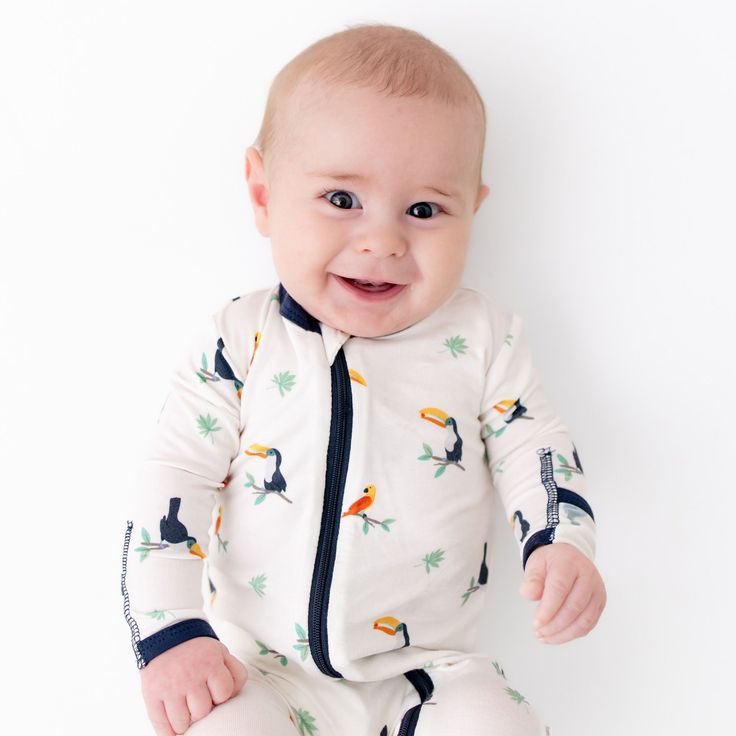 Breathable, super soft, and wildly comfy, our bamboo baby footies will keep your little one snug and stylish on all their adventures. Each footie is made with luxurious, eco-friendly viscose from bamboo fabric for all-over comfort without the negative environmental impact. Wash before first use Machine wash cold, gentle cycle Tumble dry low Iron low if desired Do not bleach 95% Viscose from bamboo, 5% Spandex Feet grips Fold-over mitts Neckline to foot 2 way zipper Concealed zip tab at neckline Playful White Footie For Playtime, Baby Footie Pajamas, Diaper Caddy, Eco Friendly Baby, Footie Pajama, Sleep Sacks, Hooded Towel, Security Blanket, Bamboo Fabric