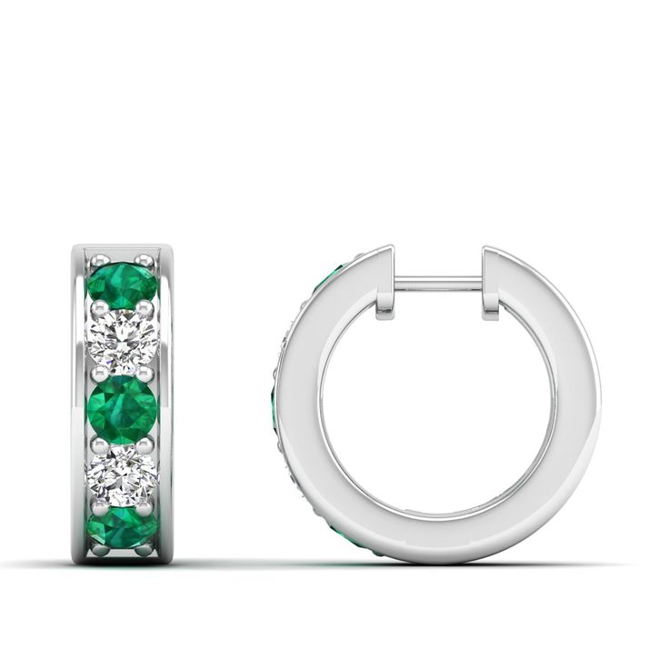 These exquisite emerald and diamond hoop earrings are a stunning addition to any jewelry collection. Crafted with precision and attention to detail, the vibrant emeralds are elegantly complemented by the sparkling diamonds, creating a luxurious and sophisticated look that is perfect for any occasion. Metal: 14K Gold Setting Type: Prong Rhodium Finish: Yes, on White Gold Gemstone Details: Gemstone: Emerald Shape: Round Average Dimensions: 3.00 MM Quantity: 06 Average Cut: Very Good Average Color: Luxury Emerald Earrings With Diamond Accents, Green Brilliant Cut Diamond Earrings, Classic Emerald Diamond Earrings Gia Certified, Classic Gia Certified Emerald Diamond Earrings, Formal Emerald Earrings With Diamond Accents, Green Diamond Earrings In Fine Jewelry Style, Green Diamond Earrings Fine Jewelry, Anniversary Green Diamond Earrings, Green Diamond Earrings With Diamond Accents