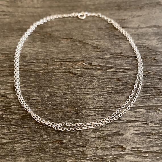 This dainty double anklet chain is just a must-have this summer. Premium quality 14K gold filled of 925 sterling silver. Feminine and elegant. Perfect gift . Adjustable length - 9.3 inches + 1 inches extensionMaterial : 14K gold filled or 925 sterling silverMy jewellery is packaged in a sturdy gift box that protects it and makes it easily to store. Online store : www.raw-london.co.ukInstagram: @rawlondonjewelleryEmail me: sales@raw-london.co.ukDo not hesitate to contact me with any doubts, I am Minimalist Sterling Silver Anklet With Adjustable Chain, Dainty Hypoallergenic Anklets For Everyday Use, Dainty Hypoallergenic Everyday Anklets, Silver Anklet With Delicate Chain As Gift, Silver Delicate Chain Anklet As Gift, Silver Delicate Chain Anklet For Gift, Delicate Silver Anklet As A Gift, Dainty Anklets With Adjustable Chain For Gift, Dainty Anklets With Adjustable Chain As Gift