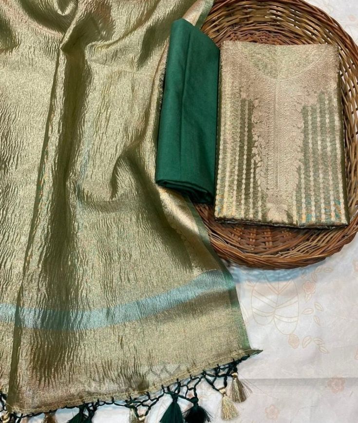 1.THIS IS BEAUTIFUL PURE TISSUE SUIT SET 2.THIS SUIT SET IS UNSTITCHED  3.IT CAN BE STITCHED AS PER THE REQUIREMENTS AND MEASUREMENTS OF THE CLIENTS.STICHING CHARGES WILL BE EXTRA. 4.KURTA IS TISSUE SILK WITH ZARI WEAVING ON THE NECK DESIGN ,DUPATTA IS TISSUE SILK WITH ZARI WEAVING ON THE BORDER,BOTTOM IS COTTON SILK OF 2.5 meters . 5.PLZ CHECK THE AVAILABILITY OF THE SARI BEFORE PLACING THE ORDER Luxury Glamorous Tissue Silk Dupatta, Luxury Multicolor Tissue Silk Set, Luxury Gold Tissue Silk Dupatta, Unstitched Pista Green Slub Silk Kurta, Gold Tussar Silk Straight Kurta Set, Gold Slub Silk Unstitched Straight Kurta Suit, Gold Slub Silk Unstitched Suit With Straight Kurta, Celebration Salwar Kameez With Sheer Dupatta In Slub Silk, Celebration Slub Silk Salwar Kameez With Sheer Dupatta