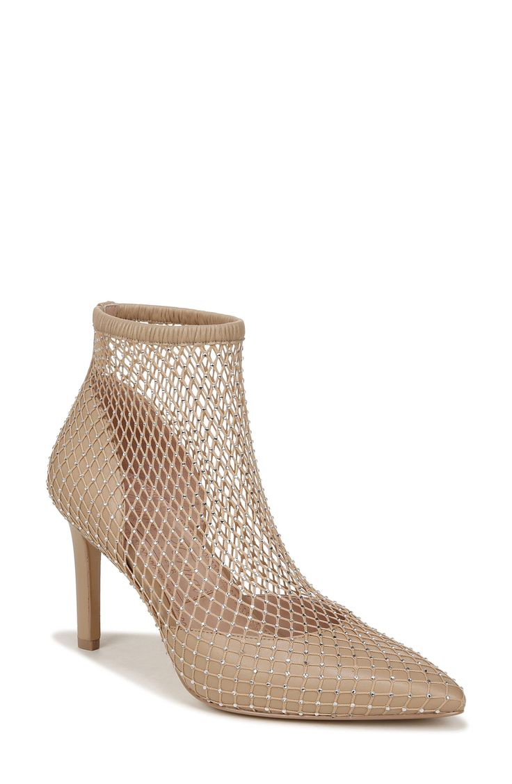 Bridal designer Pnina Tornai adds her signature shine to a pointy-toe bootie with a crystal-dotted mesh overlay. 3 1/4" heel (size 6) 4 1/4" shaft Pull-on style Leather and textile upper/textile lining/leather sole Imported Elegant Spring Booties With 4-inch Heel, Elegant Party Booties With 4-inch Heel, Pointed Toe Party Booties For Spring, Party Booties With Pointed Toe For Spring, Spring Party Booties With Pointed Toe, Spring Evening Boots With Pointed Toe, Spring Party Ankle Strap Booties, Spring Party Booties With Almond Toe, Elegant High Ankle Summer Heels