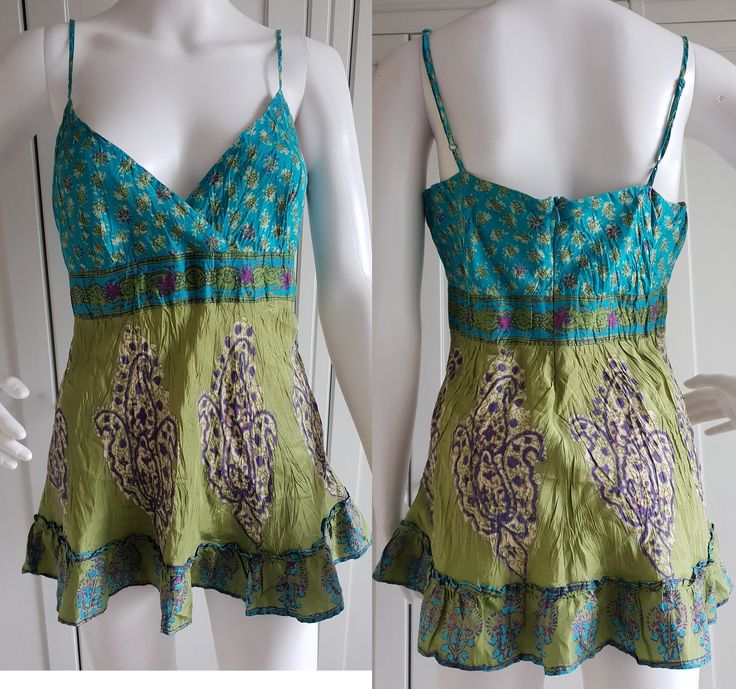 * Vintage women tank top by Warehouse * Blue / Green color * 100% Silk Size - UK 12 / US 8 / EUR 40 Length - 28 inch / 71 cm Bust - 36 inch / 92 cm Waist - 30 inch / 76 cm Hips - 38 inch / 96 cm You can also check other items from my shop: https://www.etsy.com/shop/FadoVintageShop Thank you for visiting my shop! Cotton Vest Top For Vacation, Green Cotton V-neck Tank Top, Fitted Sleeveless Top For Vacation, Green Cotton Camisole For Summer, Green Cotton Camisole For The Beach, Green Vest Tops For Vacation, Fitted Cotton Tank Blouse, Green Cotton Tank Camisole, Green Summer Vest Top