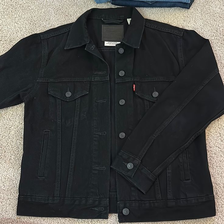 Levi’s Cute Black Jean Jacket! Literally In Perfect Condition I’ve Never Worn I Just Don’t Ever Wear It. Size S But Runs Big It Fits More Like A M Black Denim Jacket For Work With Button Closure, Black Denim Jacket For Workwear, Black Denim Jacket For Work, Black Denim Jacket With Pockets For Work, Classic Black Denim Jacket For Work, Classic Black Button-up Denim Jacket, Classic Black Denim Jacket, Classic Black Denim Jacket For Winter, Classic Black Long Sleeve Denim Jacket