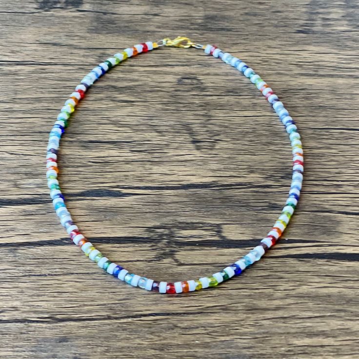 Colorful Beaded Heishi Necklace - For Men or Women :) This bright mix of beads makes the perfect Necklace/ Choker for any day. Made to order in the length and finish of your choice. Special Requests are always welcomed! Gift one for him, her or yourself <3 Casual Rainbow Beaded Necklaces With Round Beads, Casual Rainbow Beaded Necklaces, Casual Rainbow Beaded Necklace, Beaded Chain Strand Beads Gift, Festival Necklace With Round Letter Beads, Casual Rainbow Round Beads Necklace, Casual Rainbow Round Beaded Necklace, Casual Single Strand Beaded Necklace, Heishi Beads Strand Necklaces As Gift