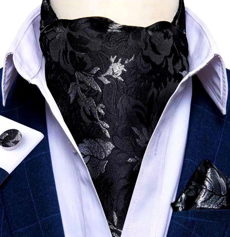 Looking for that sophisticated touch to turn heads and leave a lasting impression? Look no further than this Silk Ascot and Pocket Square Set with Woven Cufflink Set! It is crafted with the finest materials and meticulous attention to detail, ensuring you exude confidence and timeless style. Unveil timeless elegance with this meticulously crafted 3-piece ensemble, including a silk ascot, a woven pocket square, and perfectly matching cufflinks. This set is more than just an accessory; it's a statement that defines your refined taste. Perfect for a variety of occasions, from weddings and formal events to business meetings and casual parties. Don't settle for the ordinary. Elevate your look with this Silk Ascot and Pocket Square Set with Woven Cufflinks. Order yours today! Key Features: Luxur Cravat Tie, Style Gentleman, Ascot Ties, Man Dressing Style, Silver Leaves, Cufflink Set, Paisley Floral, Luxury Silk, Tie Set