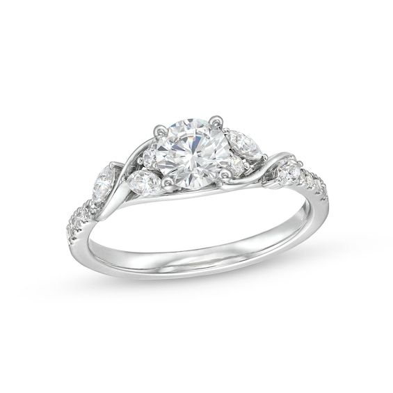 Start your love story with the elegant and charming details of this round diamond cascading vine engagement ring. Crafted in 14K white gold The 5/8 ct. round diamond sparkles at the center. A cascade of marquise-cut and round diamonds shimmers along curved vine-like ribbons. Diamonds line the shank to complete the look. This engagement ring shines with 7/8 ct. t.w. of diamonds. Swirl Diamond Ring, Pretty Engagement Rings, Cute Engagement Rings, Future Engagement Rings, Minimalist Engagement Ring, Elegant Engagement Rings, Real Gold Jewelry, Swirl Ring, Engagement Ring Shapes