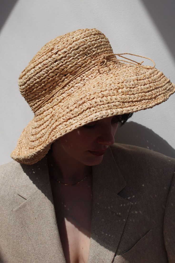 Vintage stunning straw hat with wide brim and tie accent. Favorite classic that can be worn at the beach or around town :) Can be styled with gold toned jewelry and favorite market dresses or over swim. Material not listed, assuming raffia Tag reads Kaminski Australia - Handmade in Madagascar Measures approximately: 22.5" circumference / 5" brim Some light wear to the inner head band - does not affect the overall look or wear. If you would like additional info or images prior to final sale purch Gold Straw Hat With Curved Brim For Vacation, Gold Curved Brim Straw Hat For Vacation, Adjustable Bohemian Straw Hat For Garden Party, Chic Straw Boater Hat For Garden Party, Gold Flat Brim Sun Hat For Beach, Elegant Natural Boater Hat For Garden Party, Bohemian Panama Hat For Summer Garden Party, Bohemian Panama Hat For Garden Party In Summer, Chic Straw Sun Hat For Garden Party